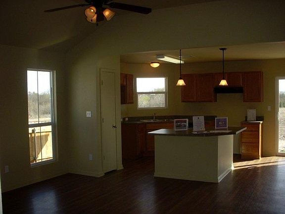 Open floor plan: living room, kitchen, dining room