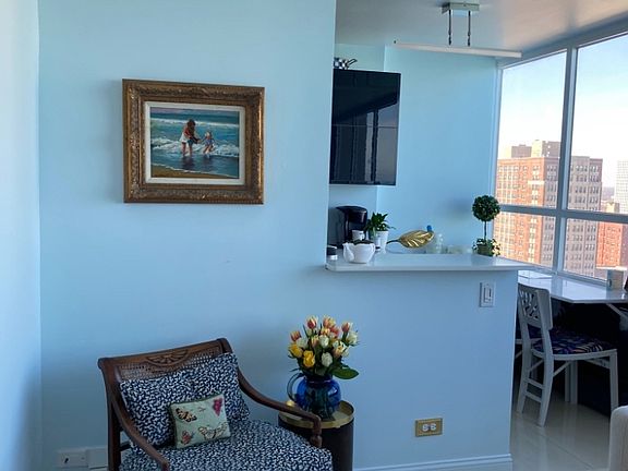 LIving Room furnishings may be reconfigured for tenant's taste. Open quart countertop into kitchen.