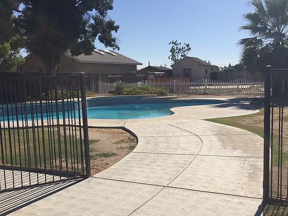 Spacious 1/2 acre lot with gated pool pool.