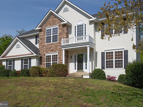 House sits up on a nice lot that backs to trees.