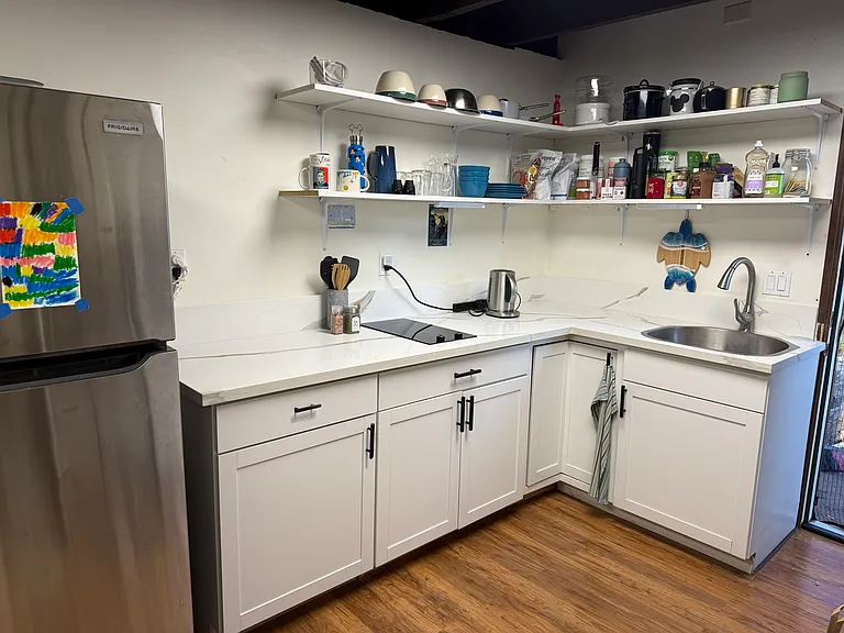 Brand new Quartz countertops, additional cabinet, and flush mounted cooktop