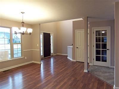Formal dining room with gleaming hardwood flooring