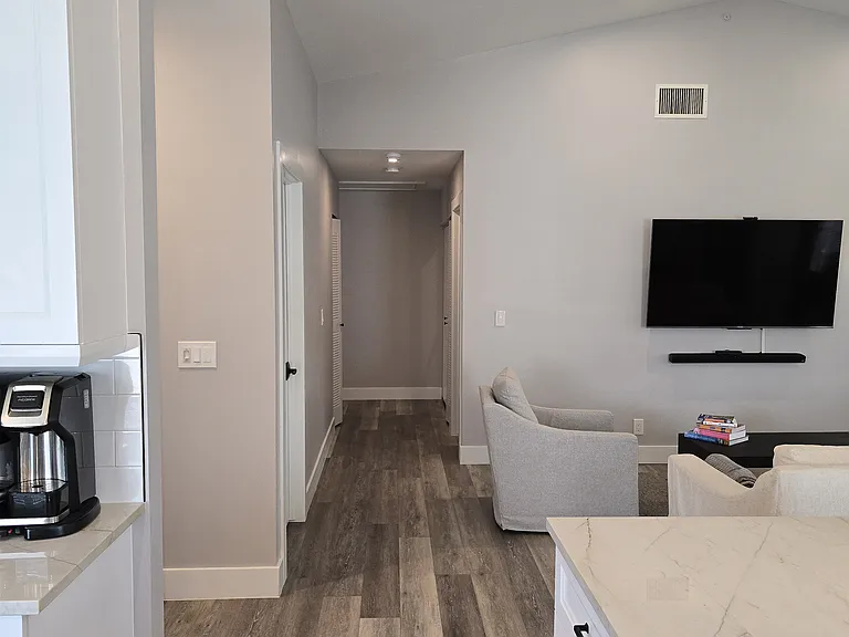 view from the kitchen into the bedroom hallway