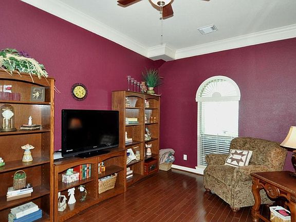 Study with French doors and hardwood flooring, Could be 4th bedroom.