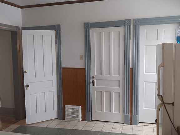 Kitchen. Middle door is the bathroom