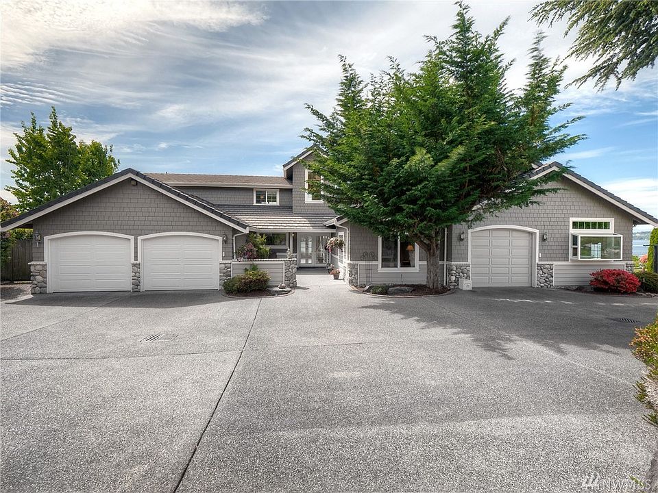 Custom Built Craftsman Style home with spectacular views of Puget Sound, Olympic Mountains, Point Fosdick, Fox, McNeil, Anderson and Ketron Islands.