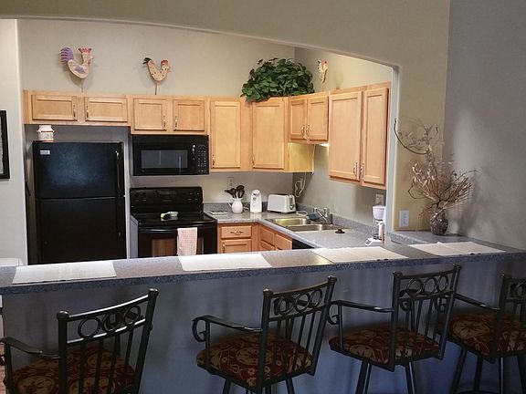 Floors are now tiled - breakfast bar between kitchen/family room