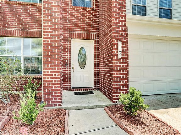 There is a pretty front door with glass window to let in more natural light to the home.