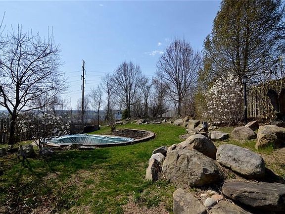 This stunning backyard also includes a built in pool.