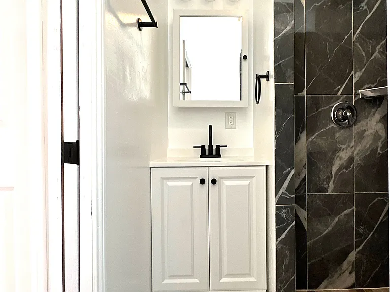Bathroom with new vanity, medicine cabinet, & light fixtures