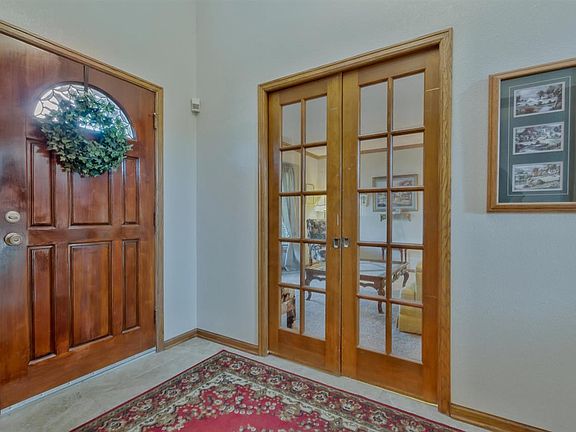 Glass pocket doors into the formal living.  This spacee would make a great main floor office too!
