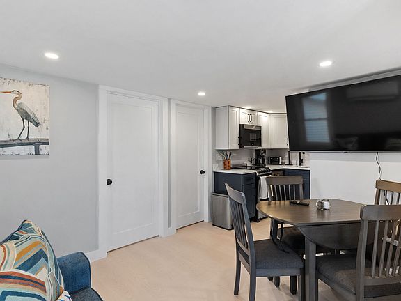 Open living/dining/kitchen space.