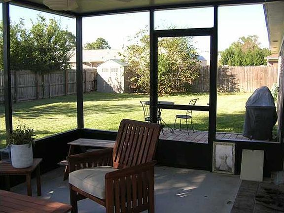 Back yard, screen room & patio view