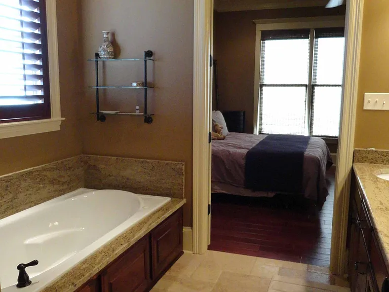 Looking into master bedroom from bathroom.