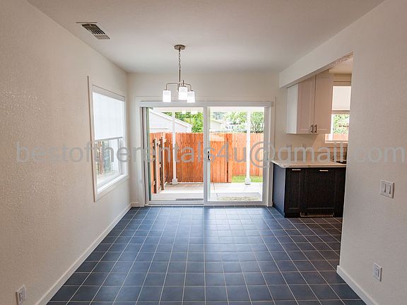 View from the front entrance through the sliding door to the backyard