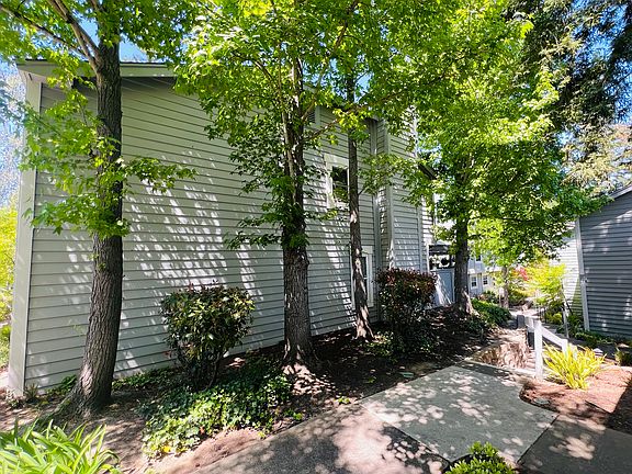 Side view, shows unit surrounded by trees