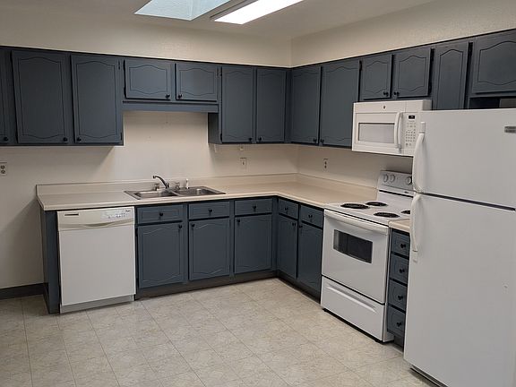 Large eat in kitchen, lots of storage and skylight for natural lighting
