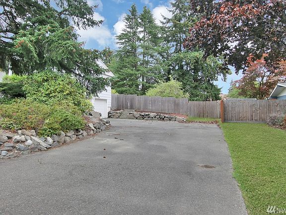 Large 2 car garage and room for RV/boat parking. 