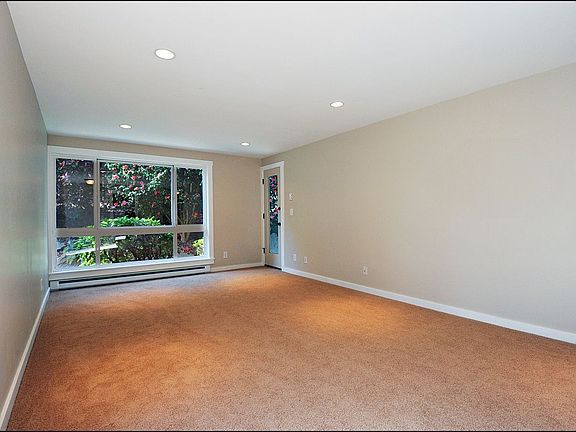 spacious living room opens to covered patio