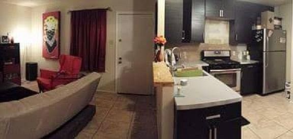 Panorama of living, kitchen, and dining rooms (bar is unfinished in pic)