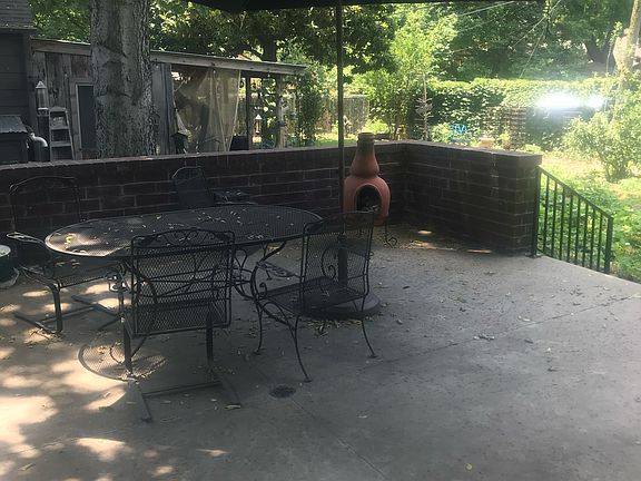 Spacious back patio overlooking the landscaped backyard