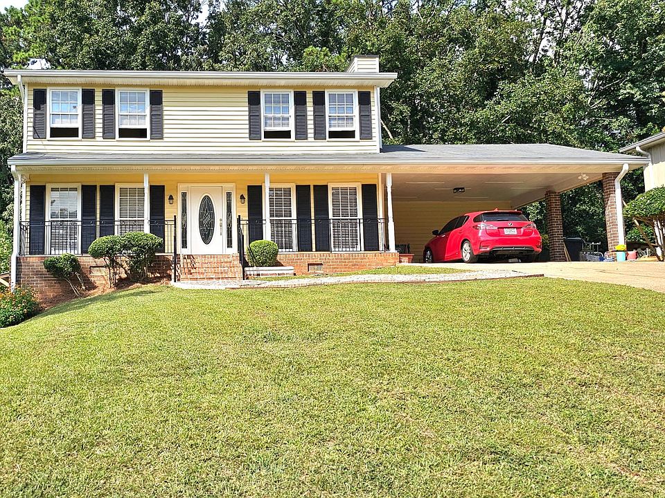 Front house view with two car carport