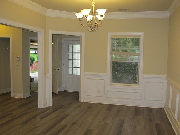 front door & garage door entrances, hallway, and dinning room
