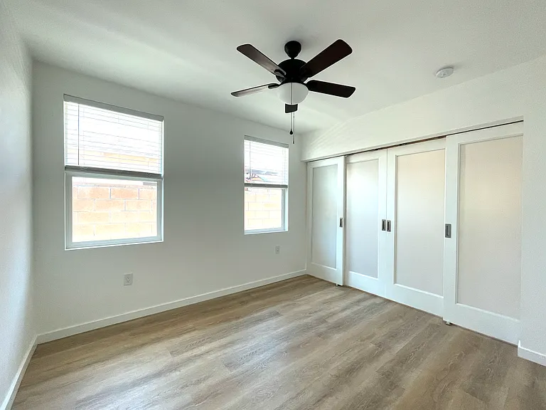 Inside bedroom with the doors closed.