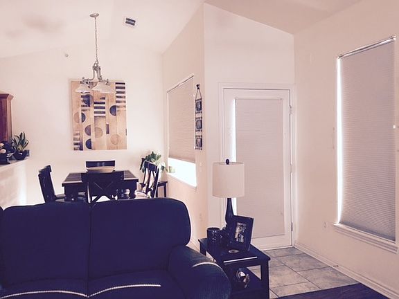 Living room, east balcony entrance, dining room