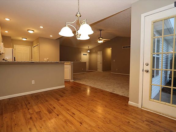 From the Dining Area to the Front Door through the Living Room.