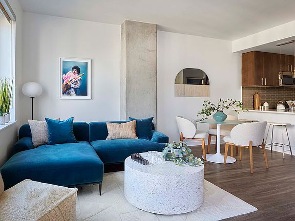 Apartment living room with wood style floor.