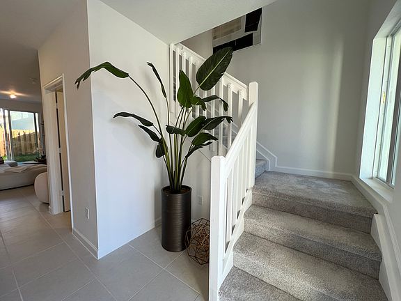 Stairs to the second floor (The property does not come Furnished, It was professionally staged for the pictures)