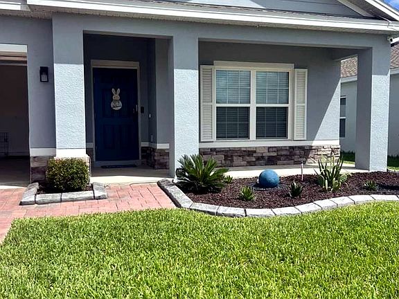 Beautiful curb appeal with well-maintained landscaping and modern exterior.