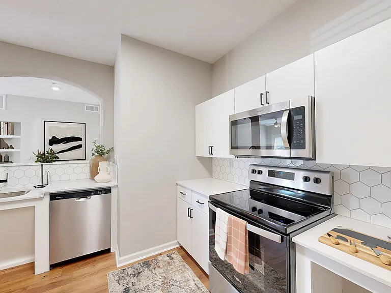 Modern open plan kitchen with stainless steel appliance package Modern open plan kitchen with stainless steel appliance package