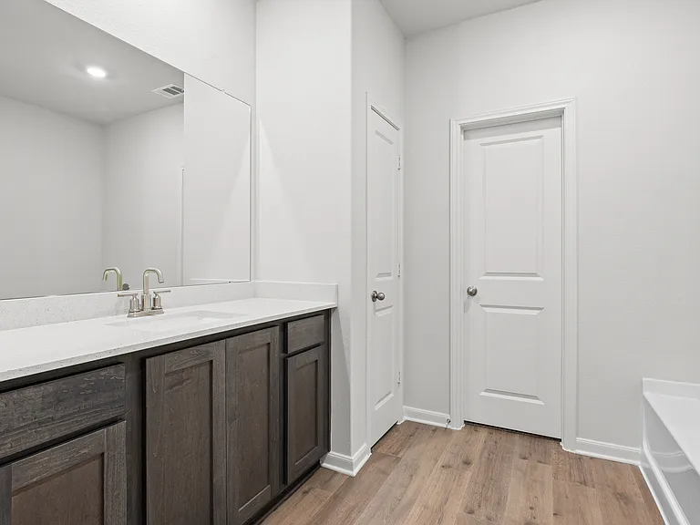 The master bathroom of the Cypress has a large walk-in shower and garden tub.