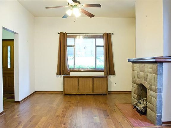 Living Room with stunning floors and stone fireplace