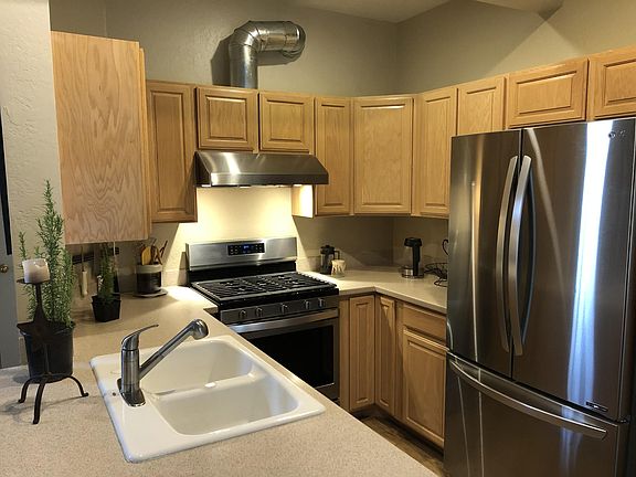 Kitchen: double DoorFridge, Range with exhaust, Double Sink, & lots of storage