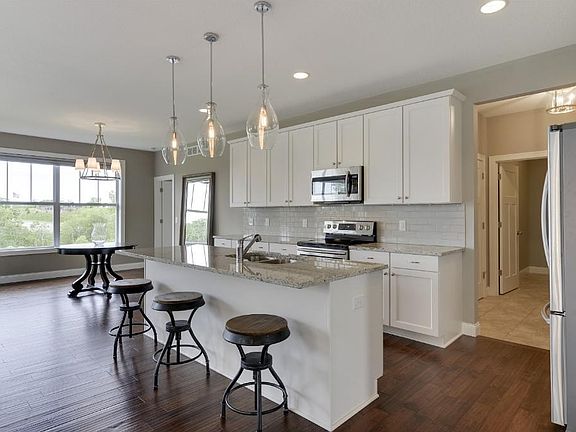 Huge center-island with upgraded appliances, cabinets, and counter-tops