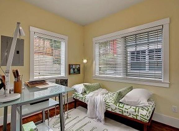 This is the 2nd bedroom downstairs beside the dining table/eating nook. Great as a guest bedroom, 2nd bedroom or office. There is a 1/2 bathroom downstairs off the living room. Wood blinds on all windows.