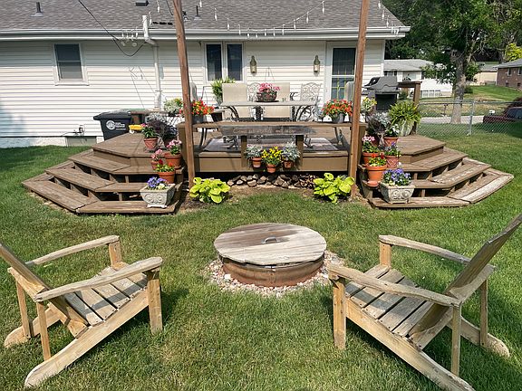 Inviting, fenced ,big back yard with built in firepit