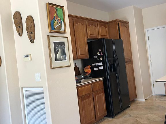 Door in from the 2 1/2 car garage into kitchen all tile flooring throughout house