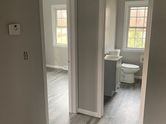 Hallway between bedrooms and full bath.