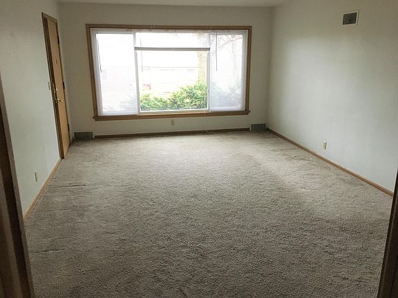 Living and family room. Front entry door.