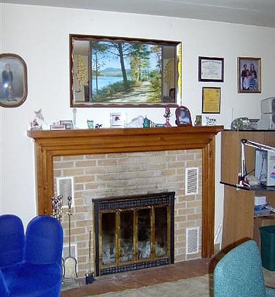 Livingroom features this lovely wood burning fireplace