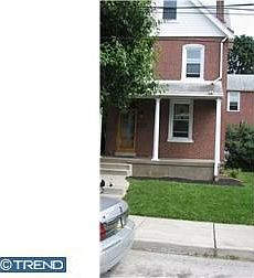 brick exterior with stone foundation
