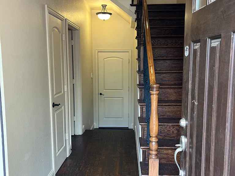 Entrance to first floor, guest suite and the garage