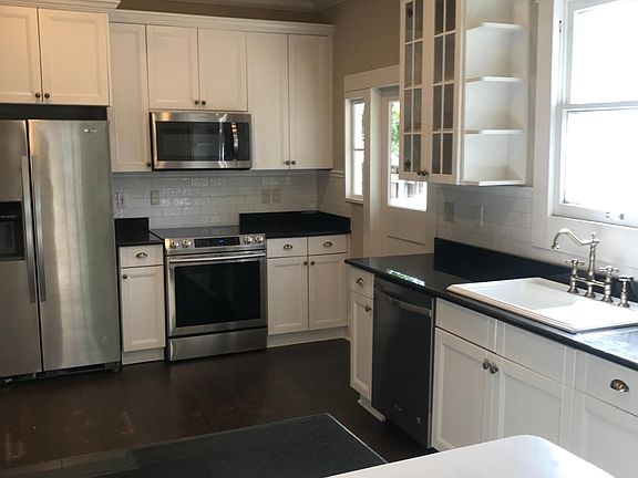 Granite counters, recessed lighting, hardwood floors