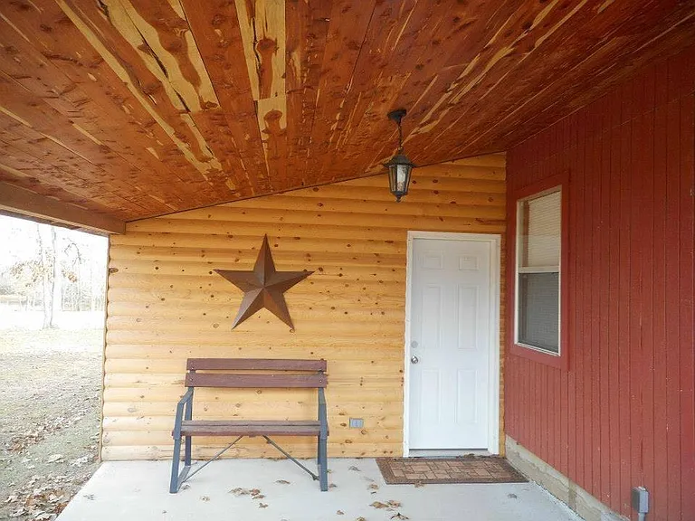 Porch with bbq grill just off bedroom