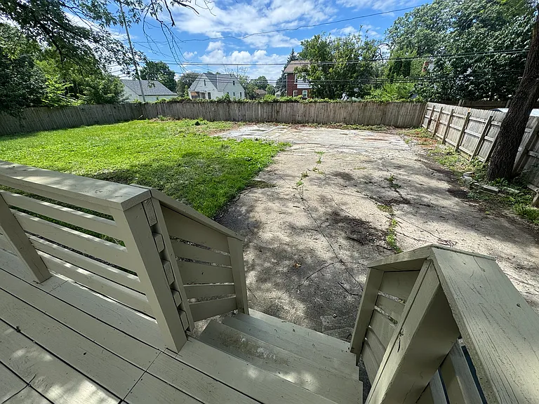 Gated, off-street, multiple parking spaces / paved backyard corner for outdoor furniture & grills!