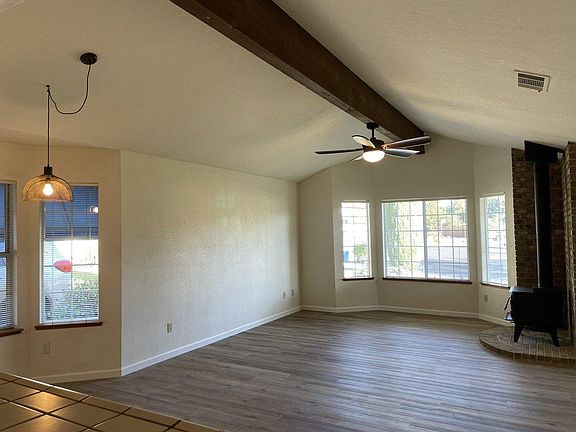 Family room & breakfast nook off kitchen with wood-burning stove